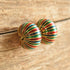 Large vintage earrings green red and green on wood background