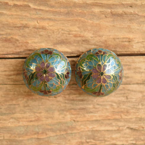 Plique a jour domed round earrings vintage on wood background