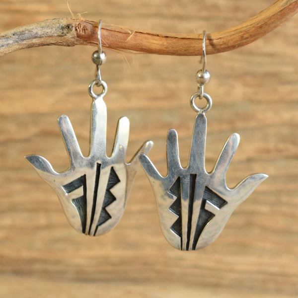 Dangle Earrings Hopi Hand shaped on wood background