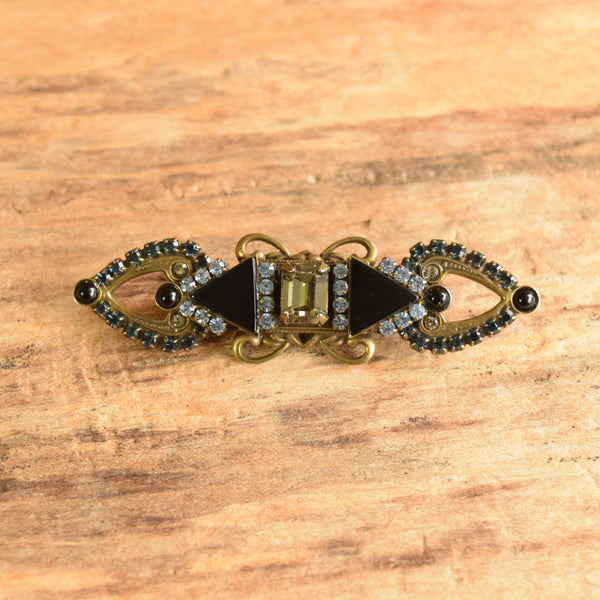 Sorrelli Victorian style rhinestone brooch blue and black on wood