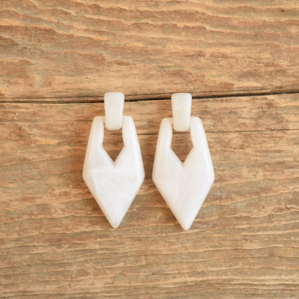 80s white marbled vintage earrings door knocker style on wood
