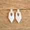 80s white marbled vintage earrings door knocker style on wood
