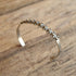 thin southwestern cuff bracelet with star stamps silver toned