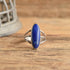 Long Blue Lapis Sterling Silver Ring Size 9 on wood backdrop