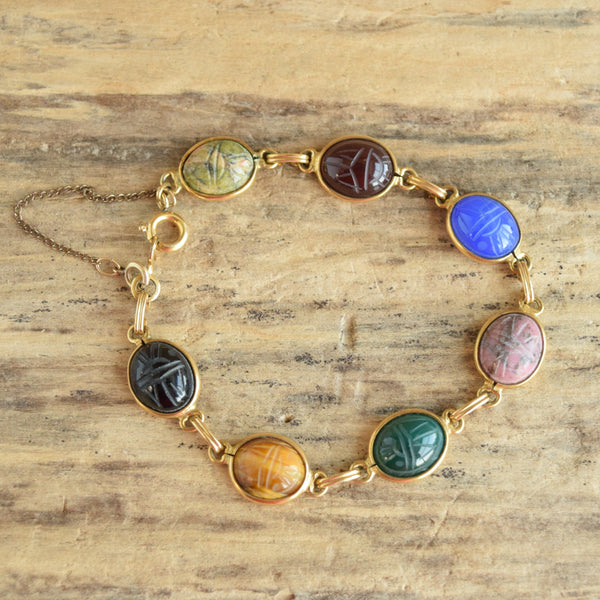 50's gold filled scarab bracelet gemstones on wood