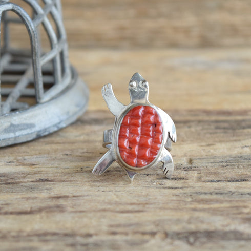 Turtle Coral Cobblestone inlay southwestern sterling silver ring on wood background