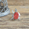 Turtle Coral Cobblestone inlay southwestern sterling silver ring on wood background