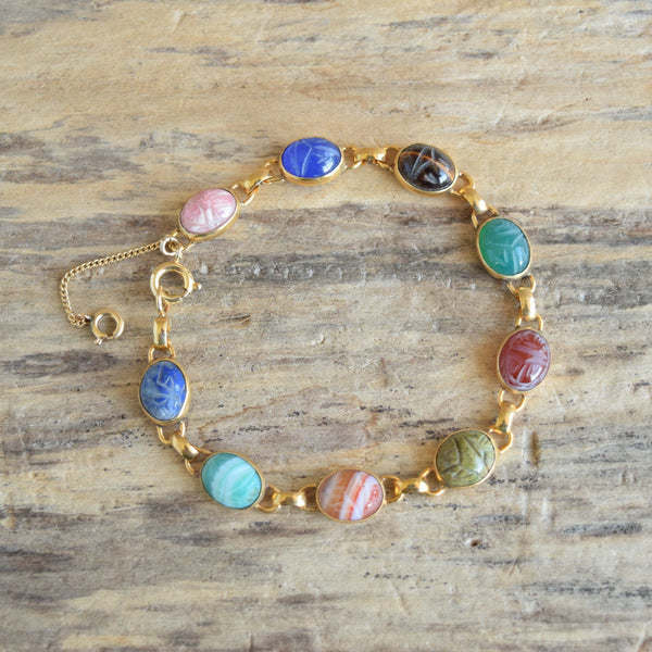 vintage 9 stone scarab gemstone bracelet on wood