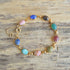 vintage 9 stone scarab gemstone bracelet on wood