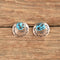 Southwestern stamped turquoise nugget earrings on wood