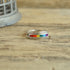 Peter Stone PSCL Rainbow Inlay Ring on Wood