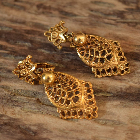 Ornate clip on earrings gold toned