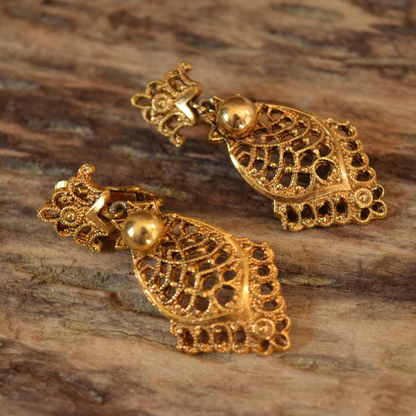 Ornate clip on earrings gold toned