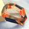 Geometric Orange and Black Bangle