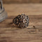 sterling silver filigree ringon wooden background